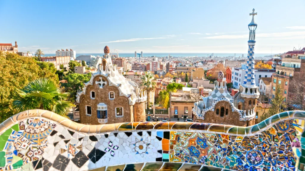Park Güell in Barcelona, one of the must-see attractions in Barcelona, featuring vibrant mosaic tiles, unique architectural elements by Antoni Gaudí, and stunning panoramic city views, showcasing top attractions in Barcelona.